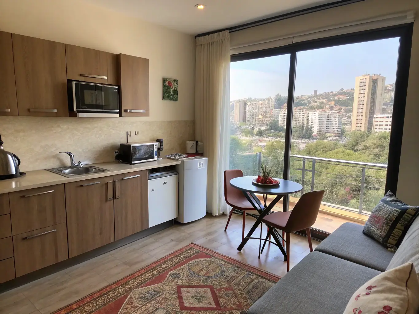 An inviting short-term apartment with a fully equipped kitchen and living area, designed for students needing temporary housing during internships or short courses.